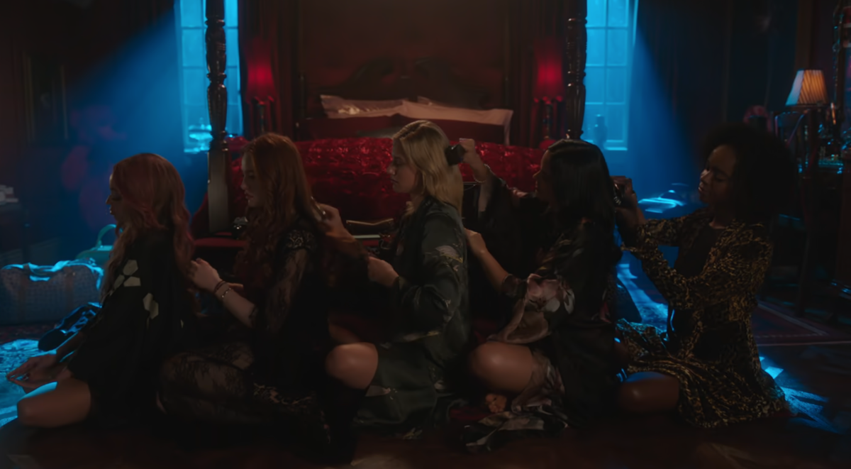 Toni, Cherul, Betty, Veronica, and Josie brush each other's hair in Riverdale