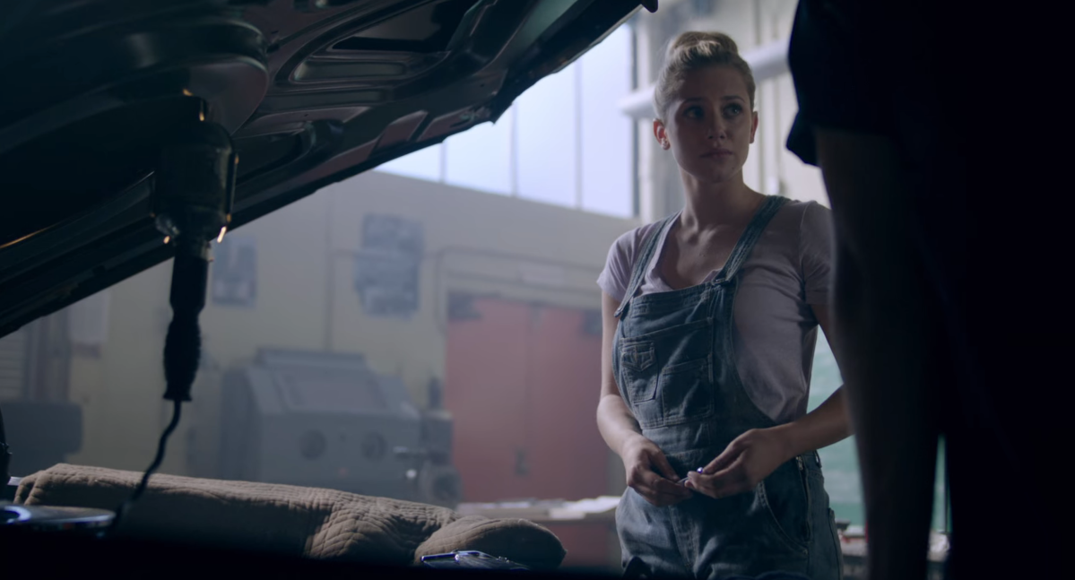 Betty Cooper fixing a car in Riverdale
