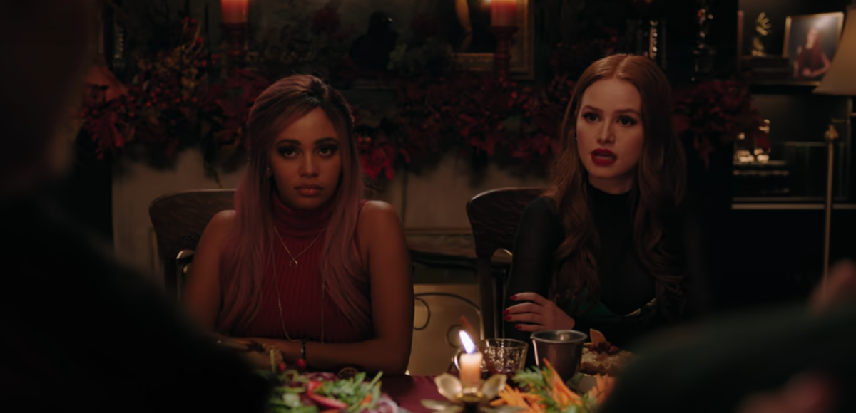 Toni and Cheryl sit at a dining table in Riverdale