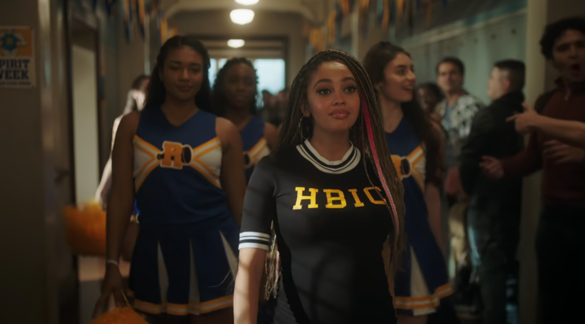 Toni strutting in a hallway in her HBIC shirt in Riverdale