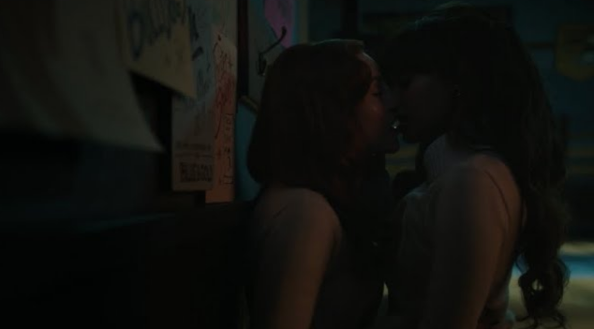 Cheryl and Toni kiss against a blackboard in Riverdale