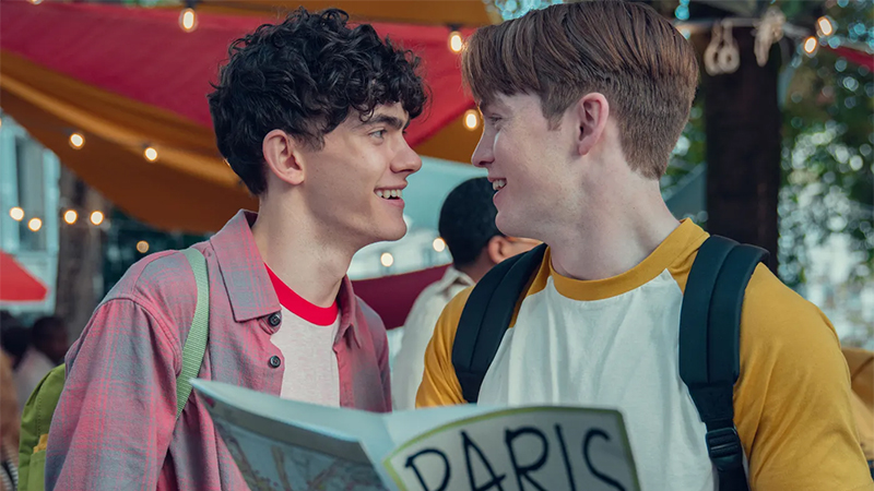 Nick and Charlie look at each other lovingly in Paris