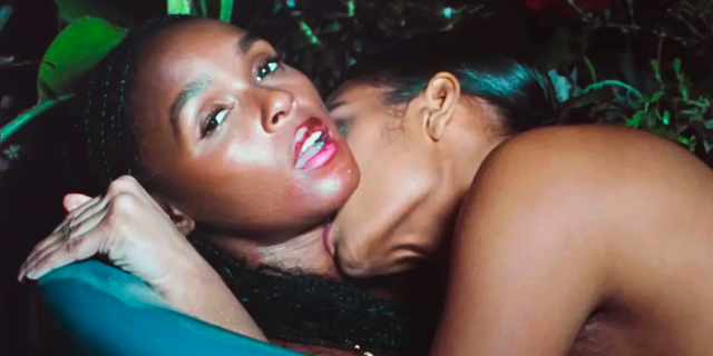 Janelle Monae gets smooched on in a music video from The Age of Pleasure