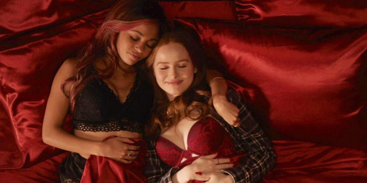 Toni and Cheryl snuggling in bed in lingerie and flannel with red silk sheets in Riverdale