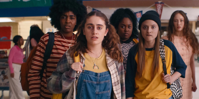 a group of teens in the movie Bottoms stand in a hallway