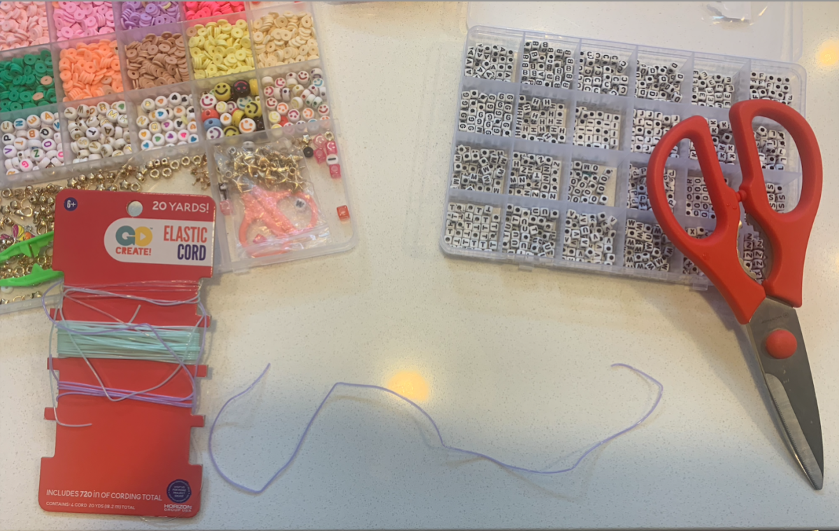 Elastic cord, scissors, and two bead kits
