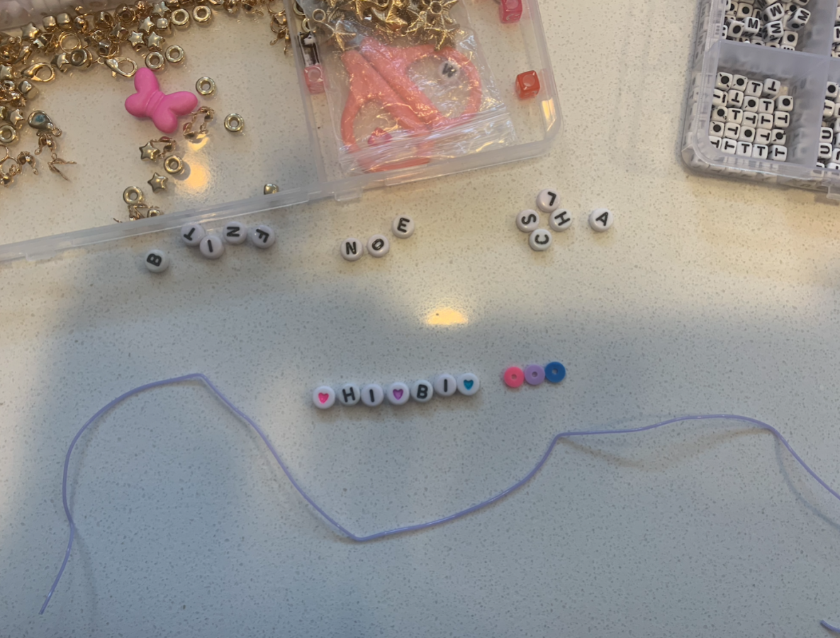 letter beads spelling out HI BI