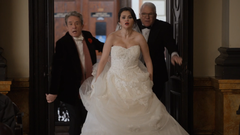 Mabel bursts into the courtroom with a wedding dress on