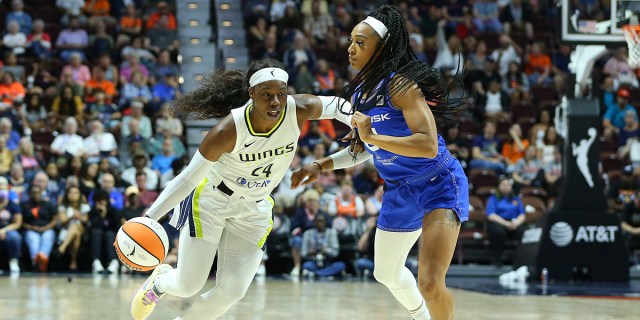 Dallas Wings guard Arike Ogunbowale (24) and Connecticut Sun guard DiJonai Carrington (21) in action during a WNBA game between Dallas Wings and Connecticut Sun on August 18, 2023, at Mohegan Sun Arena