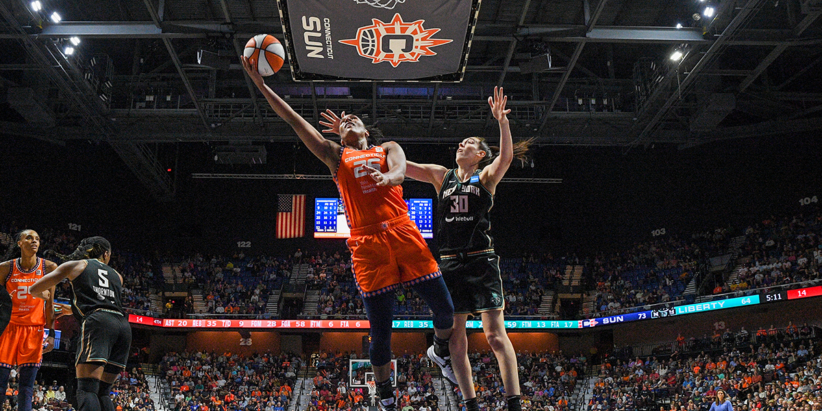 Connecticut Sun forward Alyssa Thomas (25) shoots the ball while defended by New York Liberty forward Breanna Stewart (30) during a WNBA game between the New York Liberty and the Connecticut Sun on August 24, 2023, at Mohegan Sun Arena in Uncasville, CT.