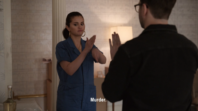 Selena Gomez as Mabel doing the ASL sign for "murder"