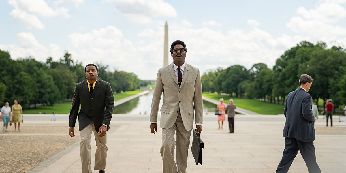Colman Domingo as Rustin walks in the National Mall with the Washington Monument behind him.