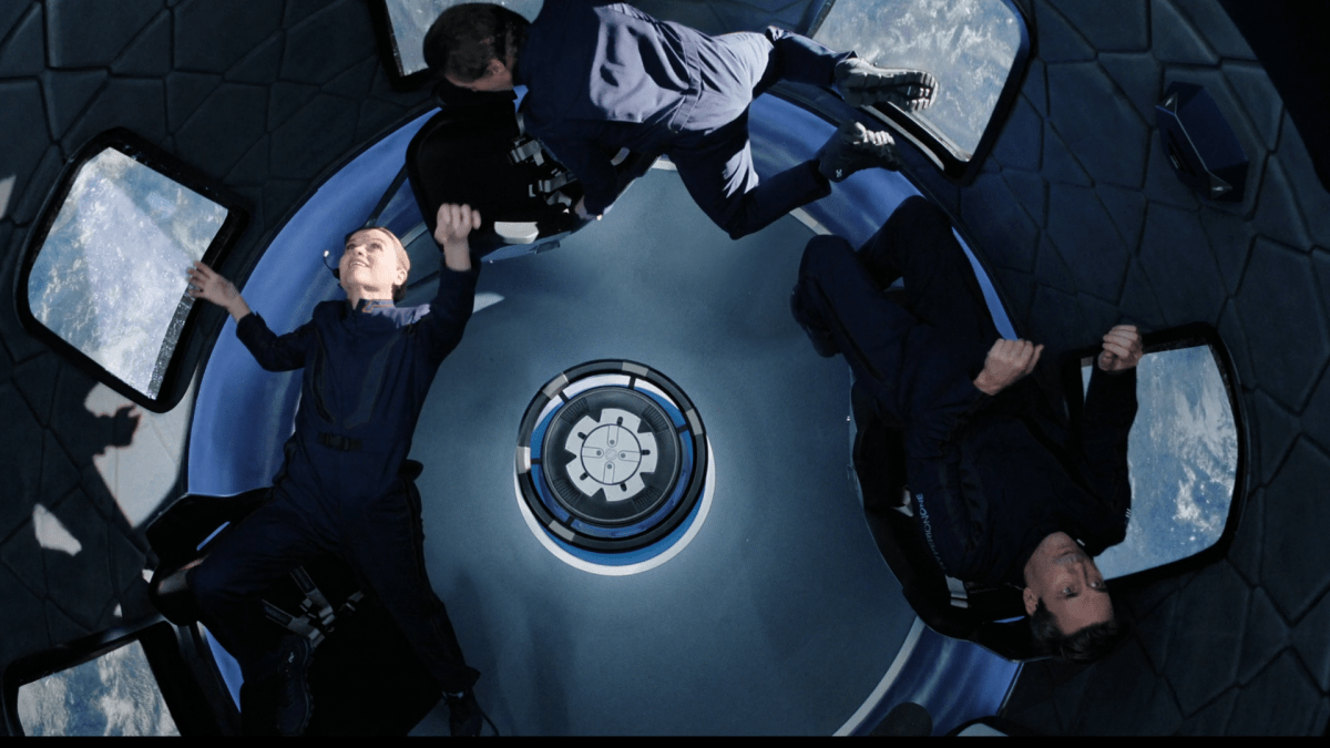 Reese Witherspoon, Billy Crudup, and Jon Hamm floating in space