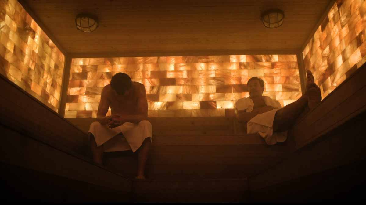 Jon Hamm sitting next to Billy Crudup in a sauna in The Morning Show season three premiere