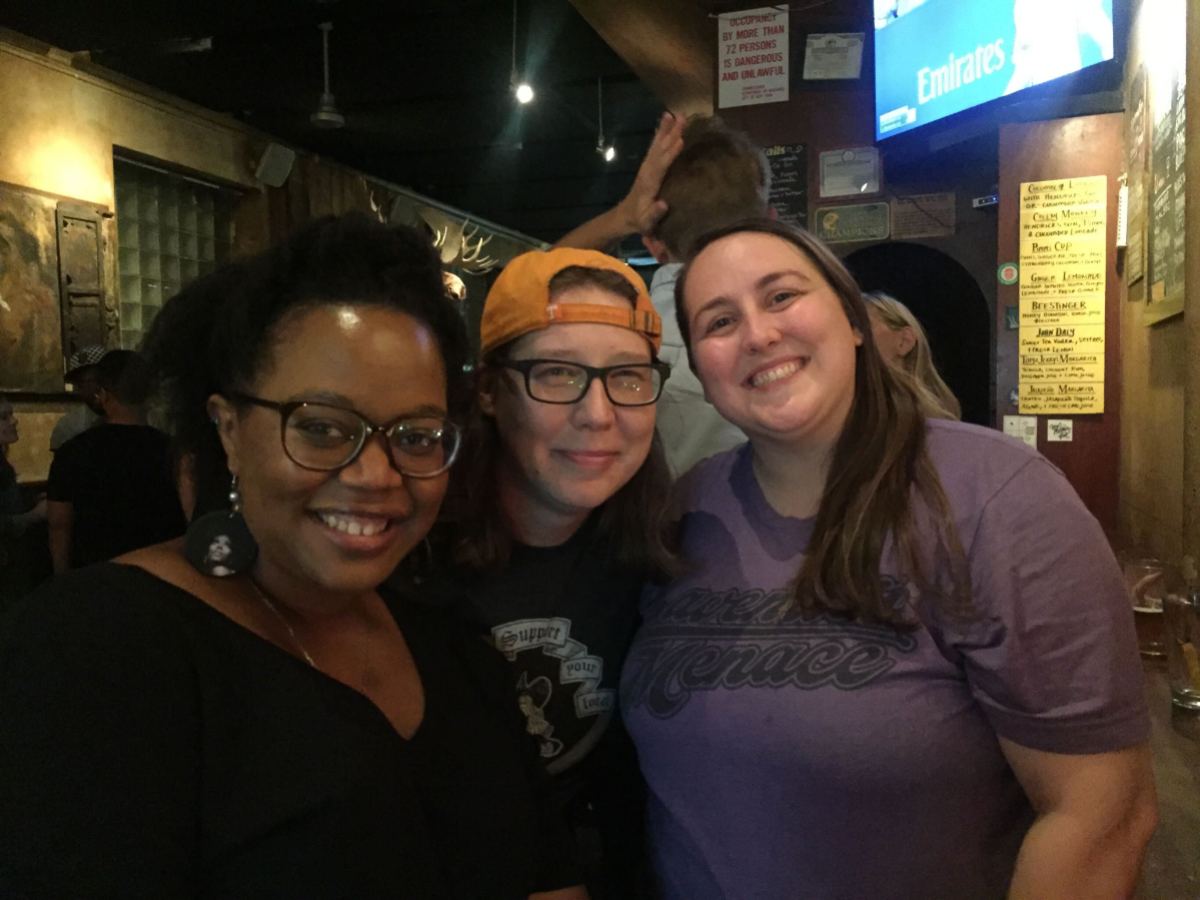 Carmen, Valerie, and Heather hanging out in a bar. 