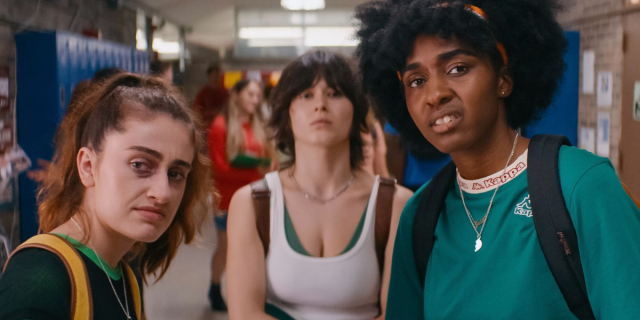 Rachel Sennot, Ruby Cruz, and Ayo Edebiri in the movie Bottoms, standing in a high school hallway and making faces of disgust