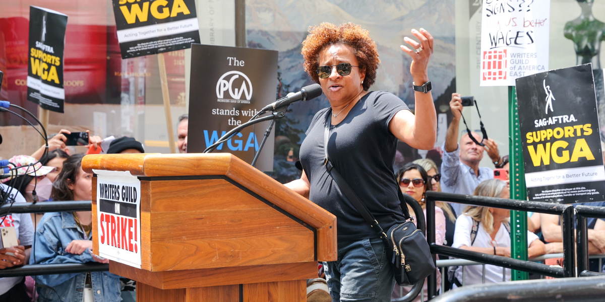 Wanda Sykes at a podium in NYC for a picketing event by the WGA and SAG-AFTRA