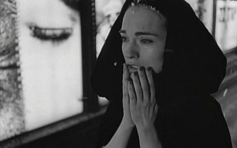 Nadja in the movie Nadja, wearing a black hooded cloak