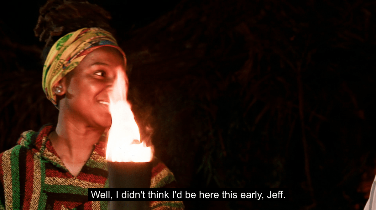 Survivor Season 45 contestant Sabiyah Broderick stands with her torch, just after being voted out by her tribemates