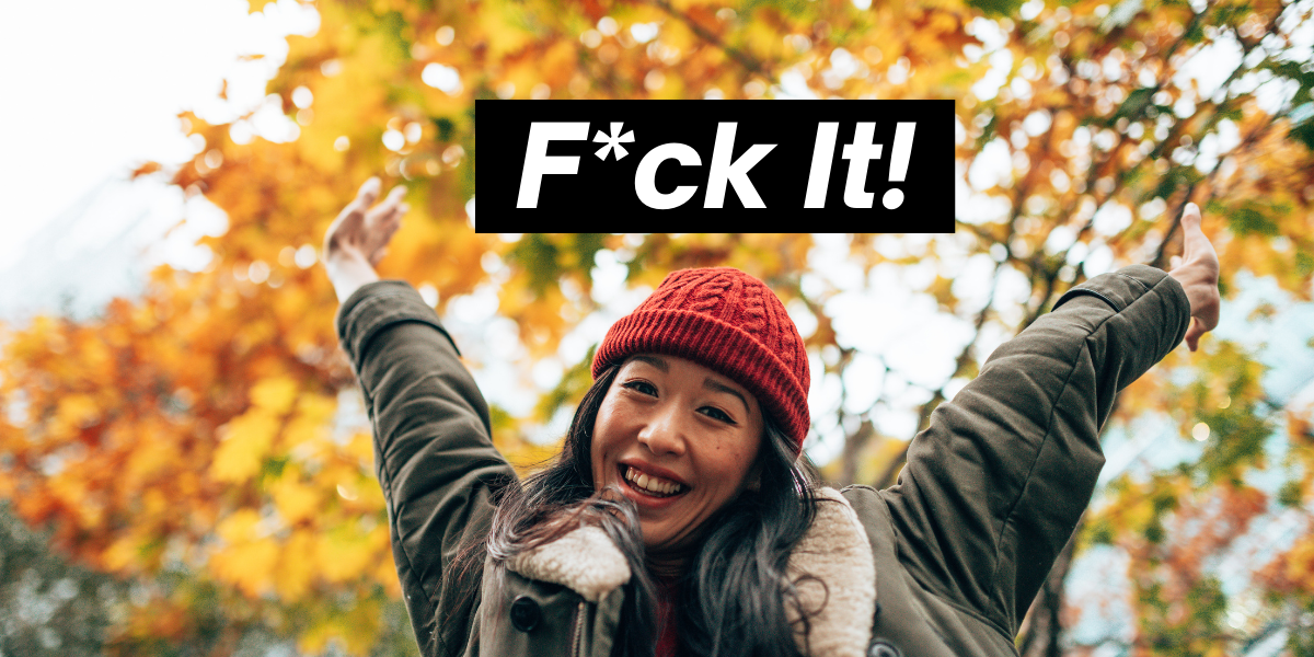 A meme of an Asian woman in a red beanie smiling in front of fall leaves, above her reads the words F*CK IT in white text on a black box background