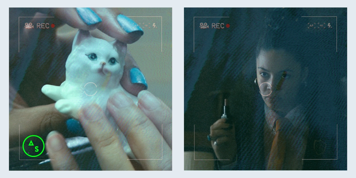Jennifer Reeder: Two images in the 80s Horror Is So Gay video recorder aesthetic. The first images is two hands passing a small cat figurine, one hand has bright blue nail polish. The other is a girl in a school uniform with blood on her face lifting up a tube of lipstick.