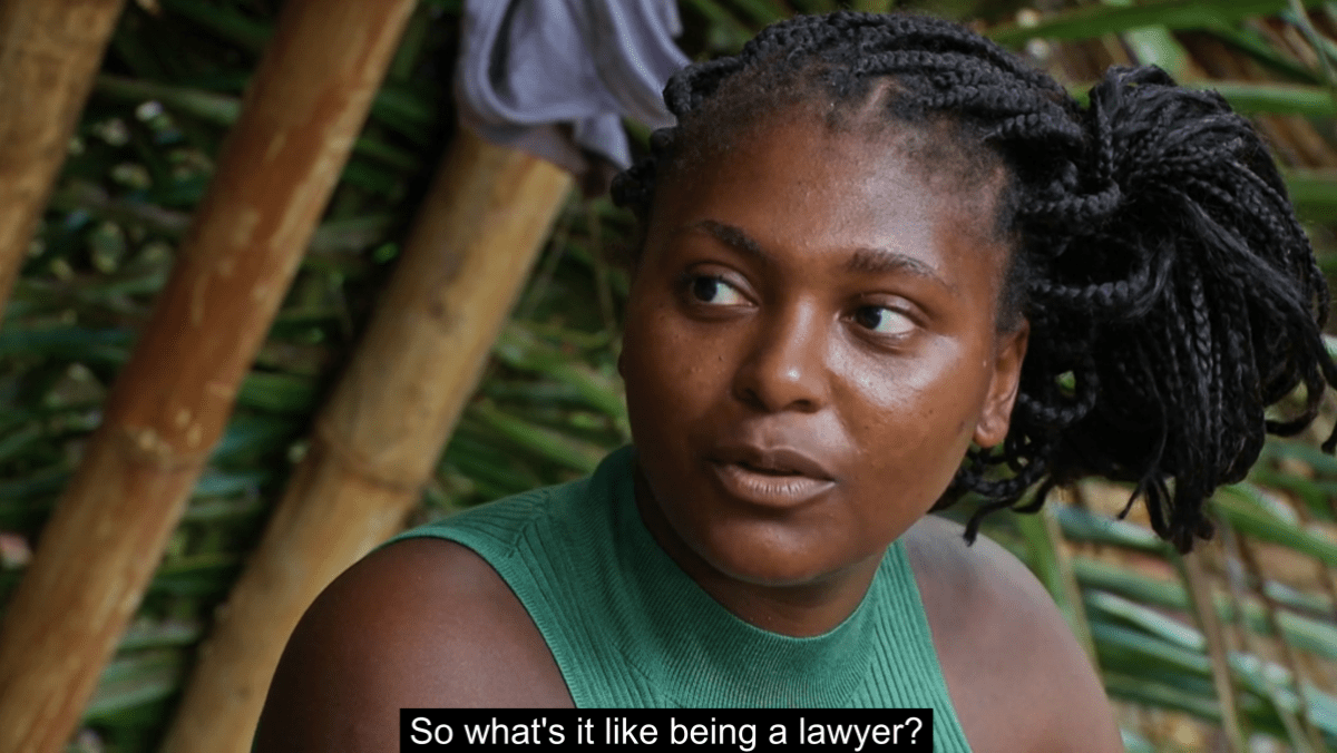 Survivor Season 45 contestant Katurah Topps glances off-camera, asking a fellow competitor, “So what’s it like being a lawyer?