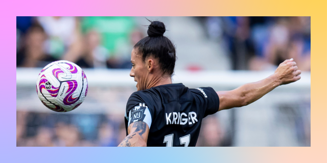 Ali Krieger in her number 11 jersey about to kick a soccer ball