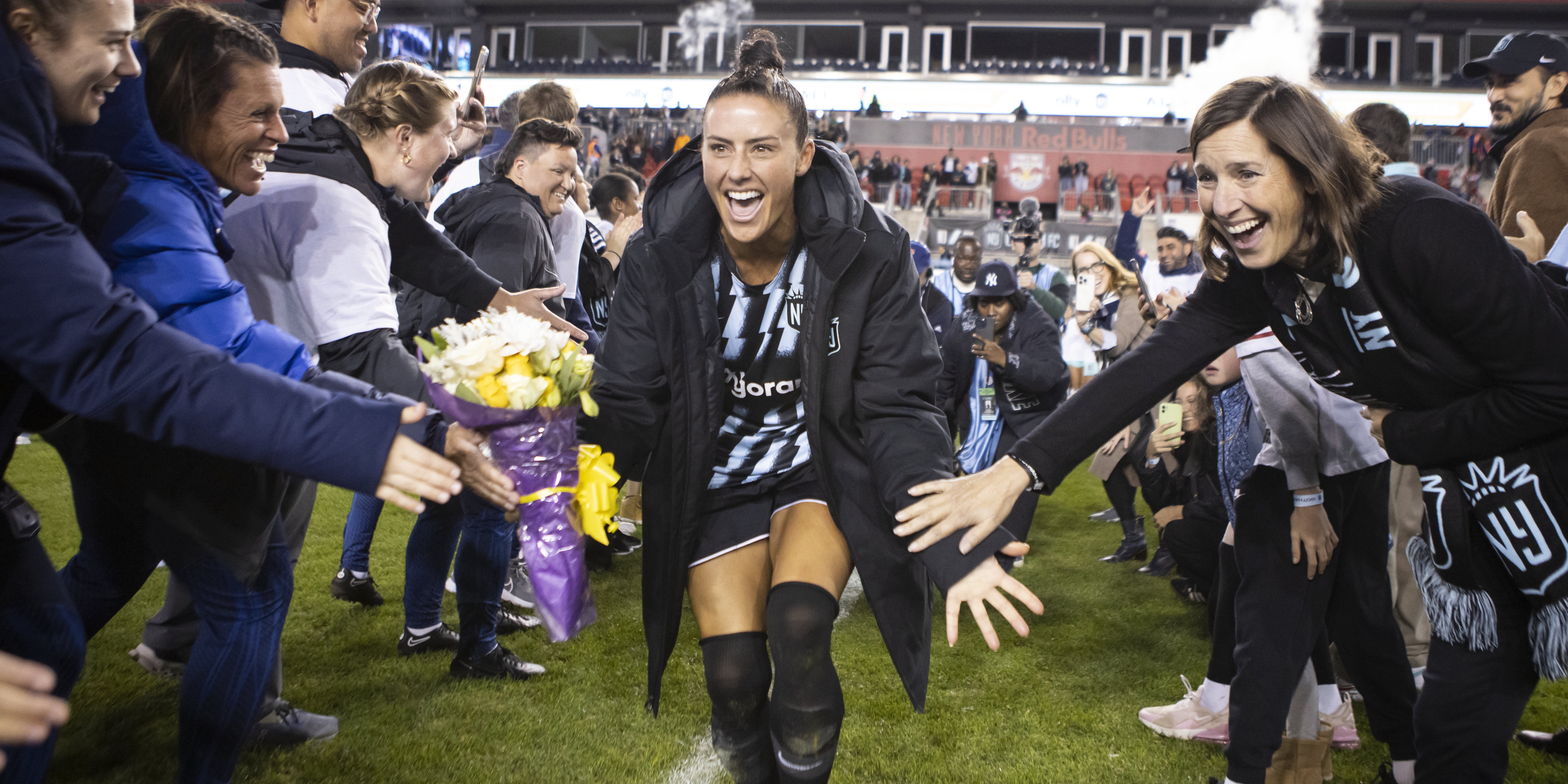 HARRISON, NEW JERSEY - OCTOBER 15: Ali Krieger #11 of NJ/NY Gotham FC celebrates with friends, family and teammates after her final home season National Women's Soccer League game against the Kansas City Current at Red Bull Arena on October 15, 2023 in Harrison, New Jersey. (Photo by Ira L. Black - Corbis/Getty Images)
