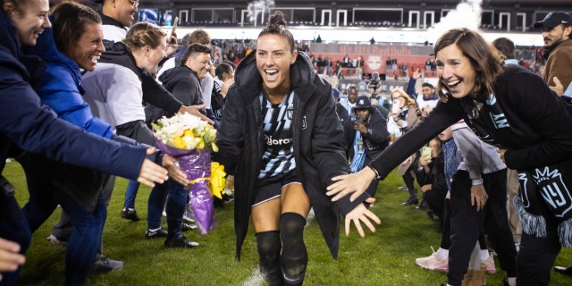 HARRISON, NEW JERSEY - OCTOBER 15: Ali Krieger #11 of NJ/NY Gotham FC celebrates with friends, family and teammates after her final home season National Women's Soccer League game against the Kansas City Current at Red Bull Arena on October 15, 2023 in Harrison, New Jersey. (Photo by Ira L. Black - Corbis/Getty Images)