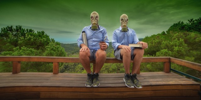 Postcard of father and son in a daily scene in a toxic future. Dystopia. photo by Andres Granollers.