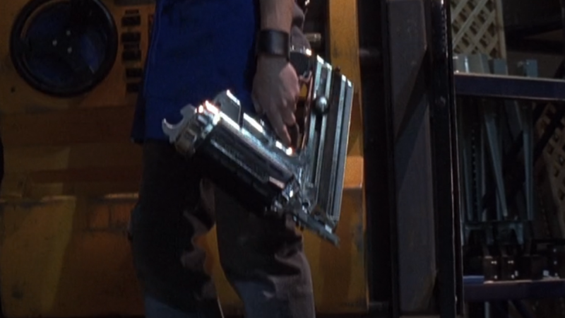 Employee holding a nail gun