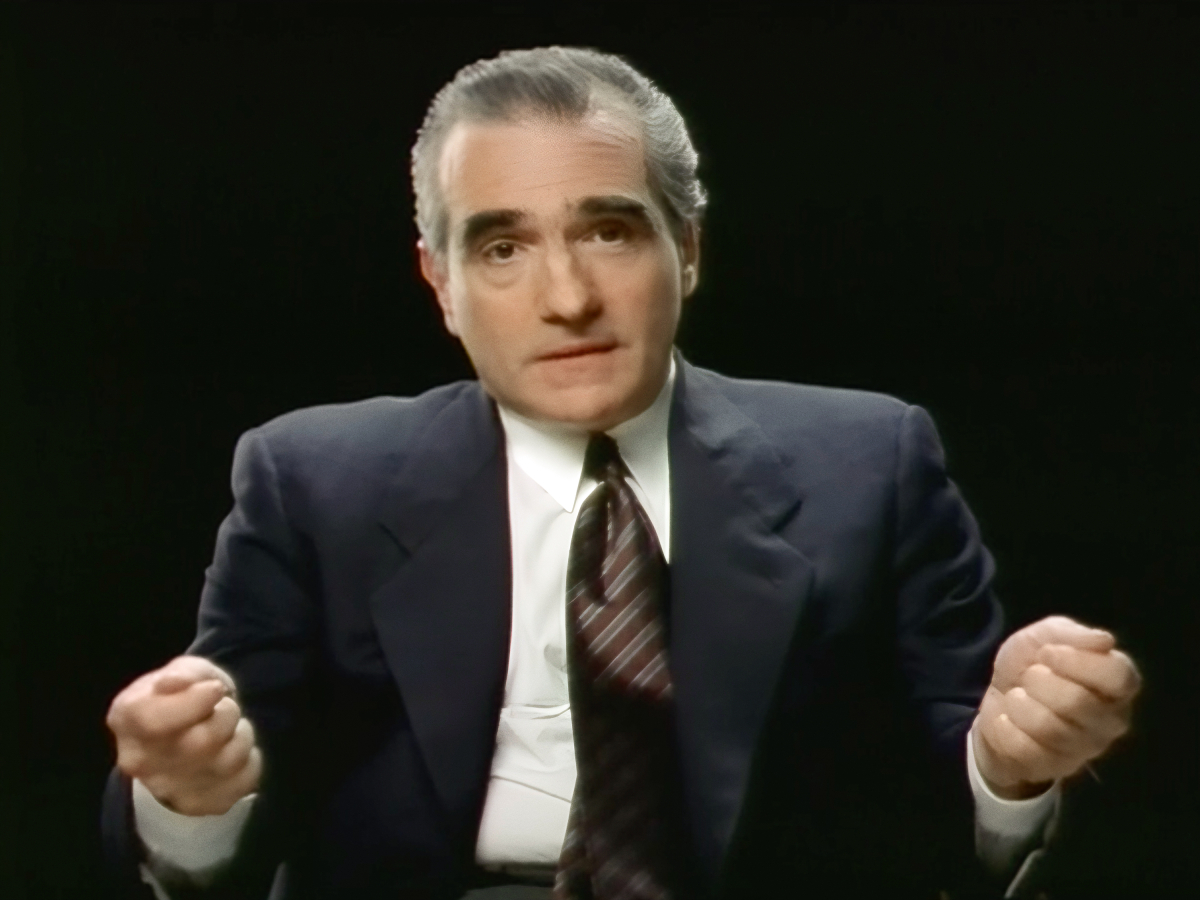 A still from A Personal Journey Through American Movies. Scorsese in a suit looks into the camera.