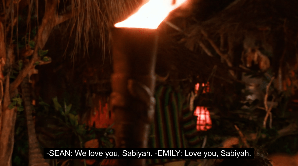 A blurry shot of where Survivor Season 45 contestant Sabiyah Broderick has just left Tribal Council, after being voted out, as her tribemates tell her they love her