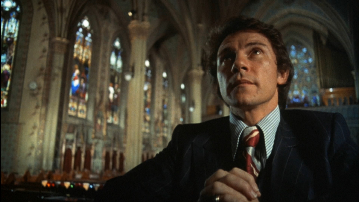 Still from Mean Streets. Harvey Keitel prays in church.