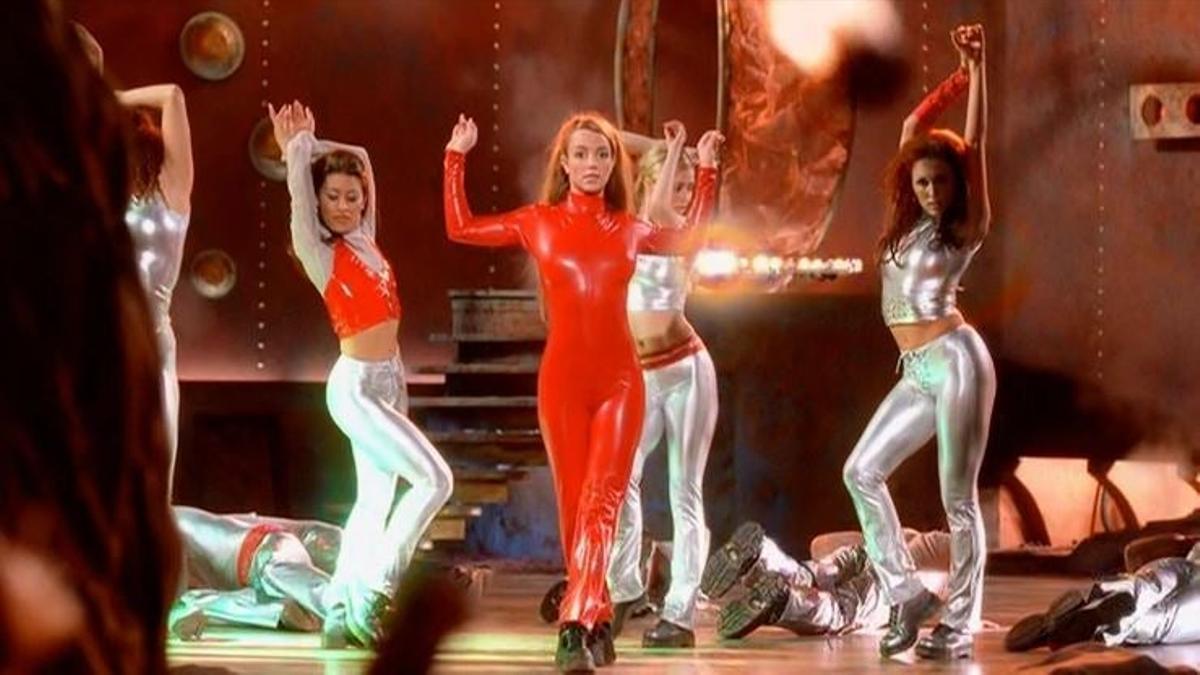 britney in a red leather catsuit surrounded by dancers in "oops i did it again"