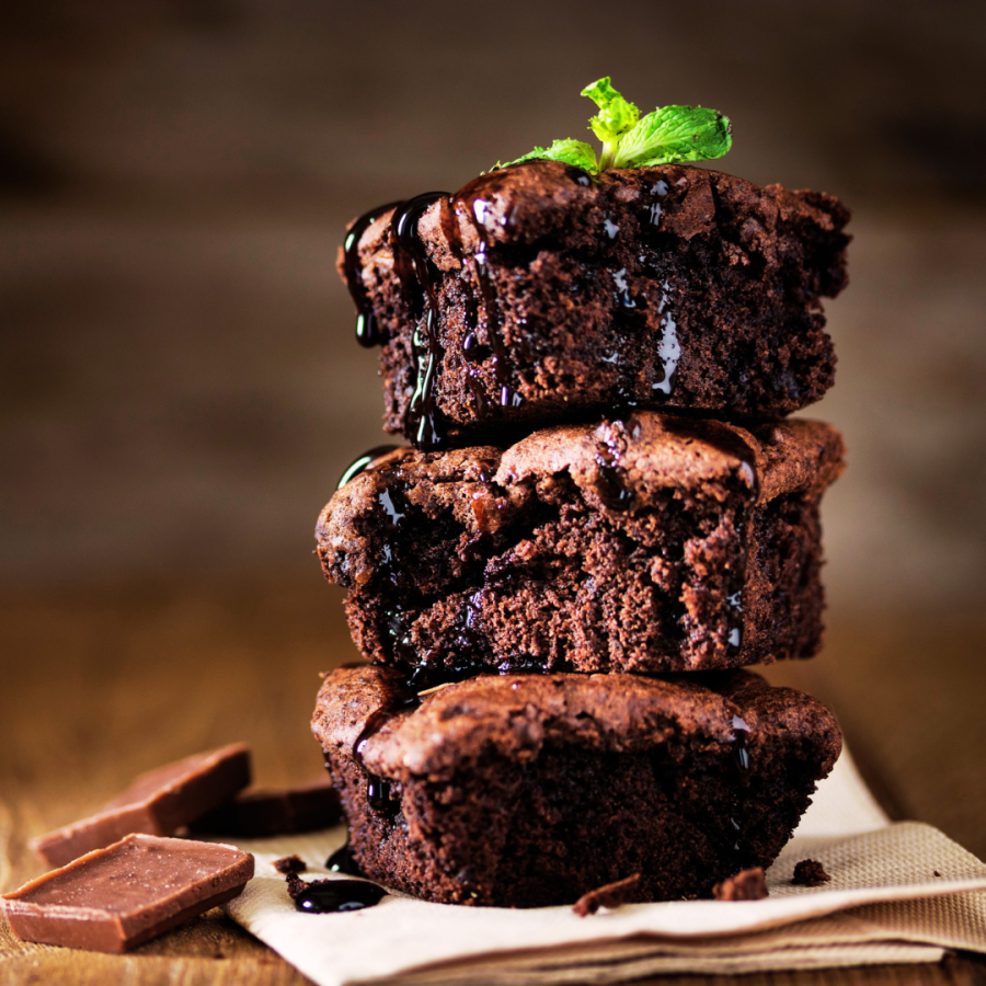 three brownies stacked with a little leaf on top