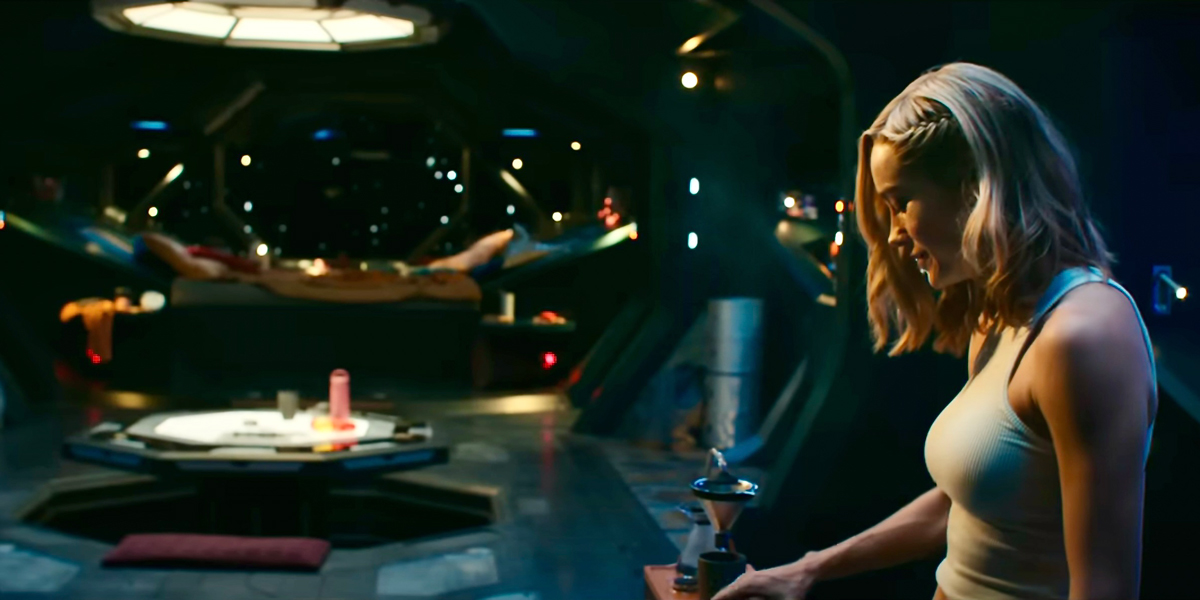 In the Marvels, Captain Marvel wears a white tank top and cooks on her space ship.