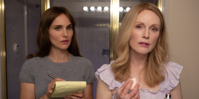 May December: Julianne Moore looks into the camera as she applies makup. Natalie Portman stands behind her also looking into the camera taking notes.