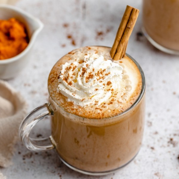 a clear mug of pumpkin spice latte