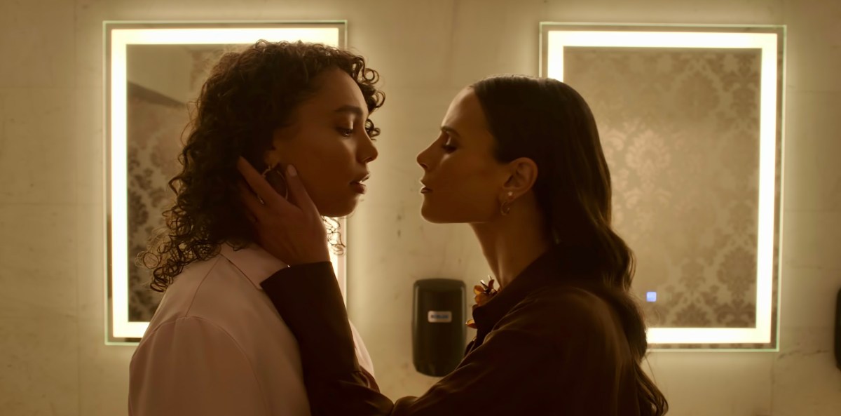 In Neon on Netflix, Gina and Ness are about to kiss in the bathroom