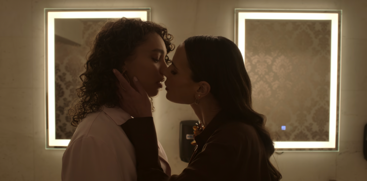 Sexy Lesbian Screenshot: In Neon on Netflix, Gina and Ness almost kiss in the bathroom
