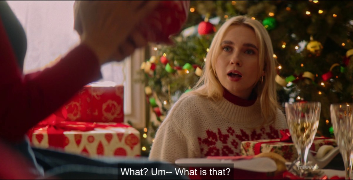 lesbian in chirstmas sweater asking "what is that?"