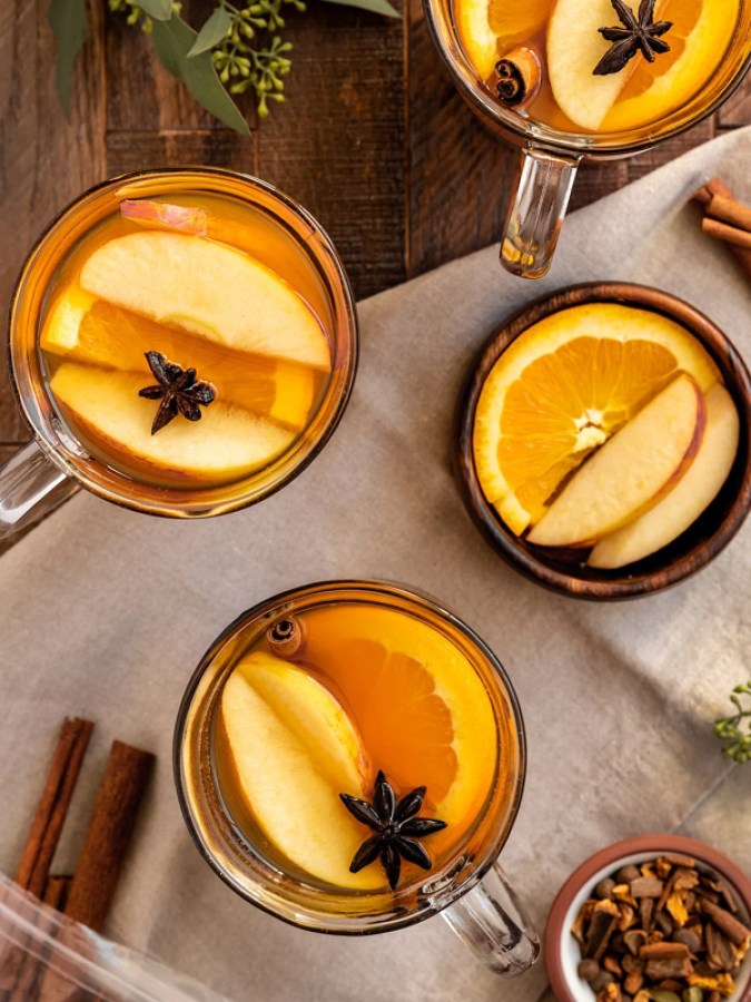 three mugs of spiked cider