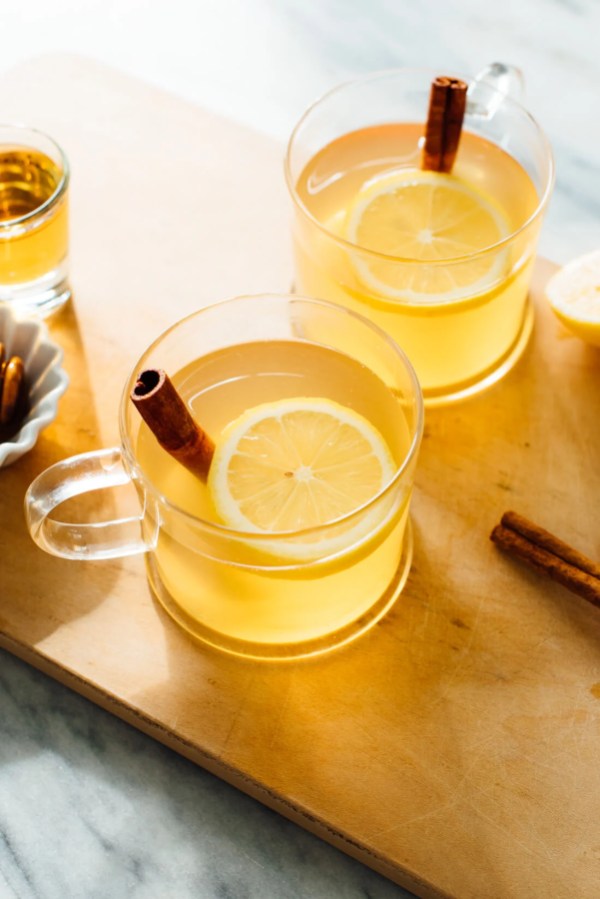 two clear mugs with hot toddies