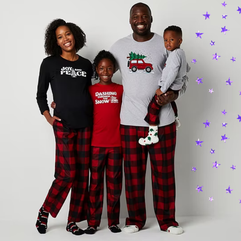 two parents and two kids in matching black and red plaid pants and Christmas-themed shirts