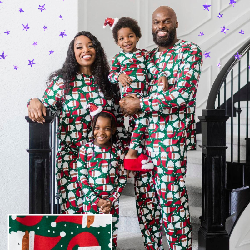 two parents and two kids in matching Black santa pajama sets