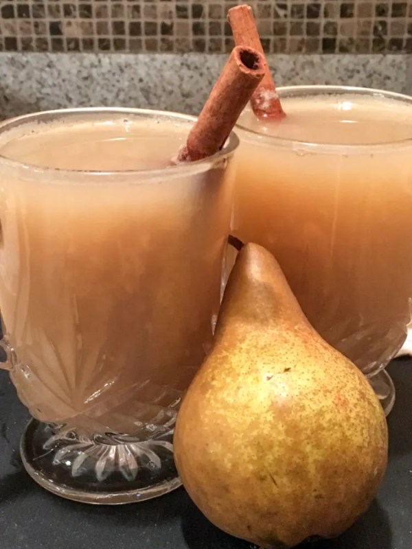 two clear mugs of pear cider