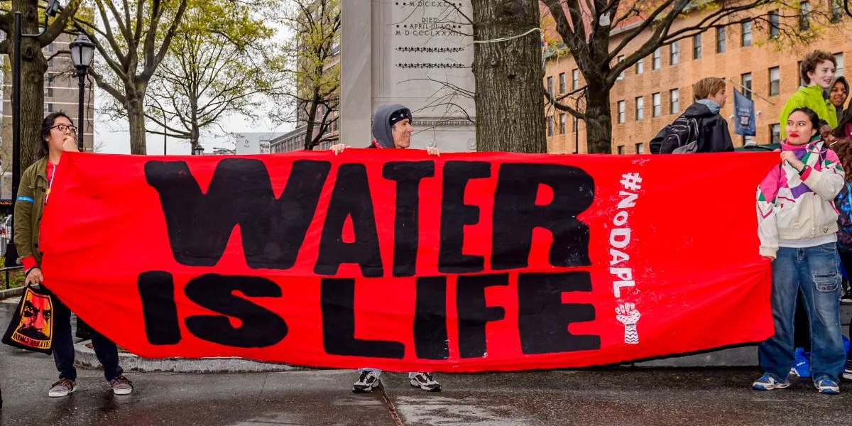 THE COOPER UNION, NEW YORK, NY, UNITED STATES - 2017/04/25: Hundreds turned out in the rain for a prayerful rally on April 25, 2017; at the historic Cooper Union to protest Citibanks annual shareholder meeting. The Indigenous-led, and ally supported event sent a strong message to Citibank and its shareholders: honor Indigenous rights, stop extractive energy investment now, and invest in a Just Transition, and renewable energy towards a climate-stable future, calling to Divest, Defund and Decolonize their investments.