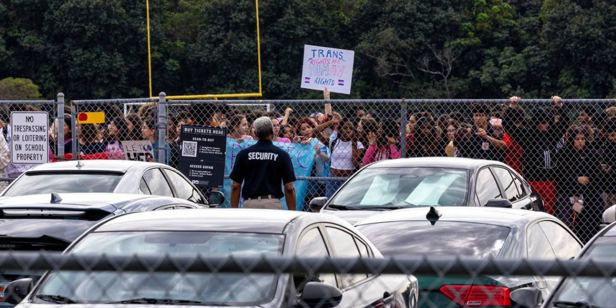 a bunch of students rally outside of Monarch High School for trans rights