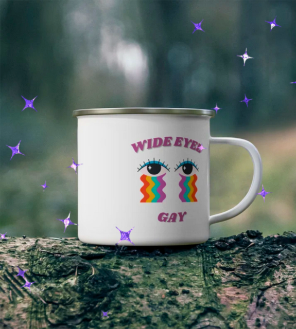 Mug with wide eyed gay written on it and an illustration of eyes crying rainbows